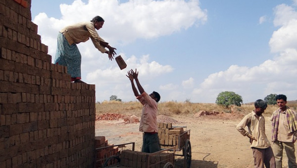 workers building a wall
